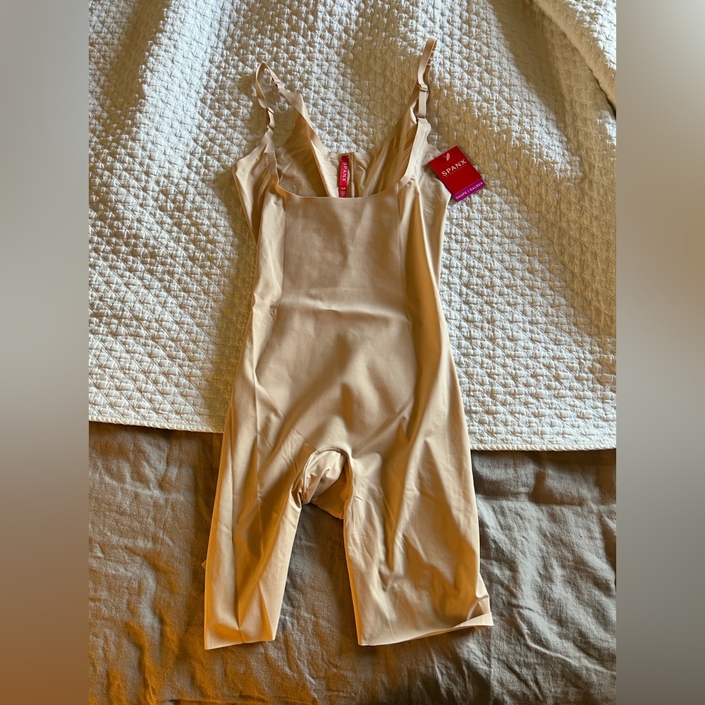 Brand new Spanx with tags! Open bust mid thigh bodysuit.